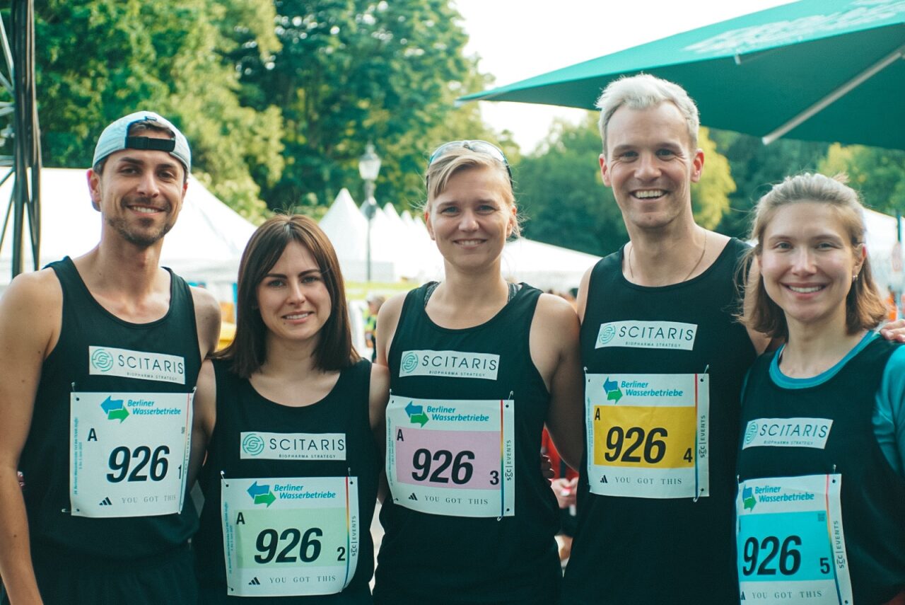Image of several Scitaris team members wearing marathon jerseys